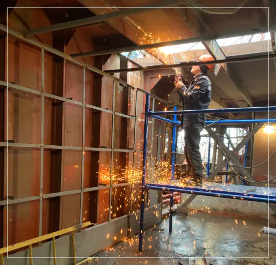 Professional Welder Working on Welding Process to the Ceiling Metal