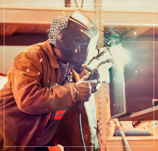 Professional Welder Working on Welding Process Outdoor